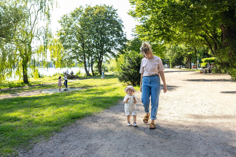 Mother walking with toddler