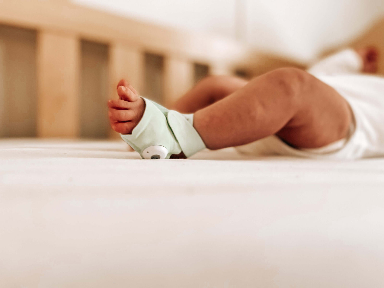 Owlet smart sock on toddler's foot