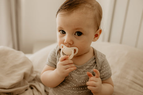 Baby with NUK soother