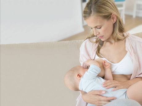 Mother breast-feeding baby