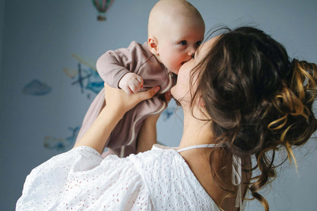 Mother playing with baby