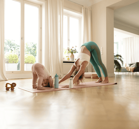 Mom and daughter stretching
