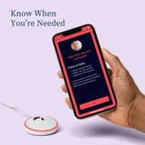 Hand holding a smartphone displaying an app with a medical device on a light purple background